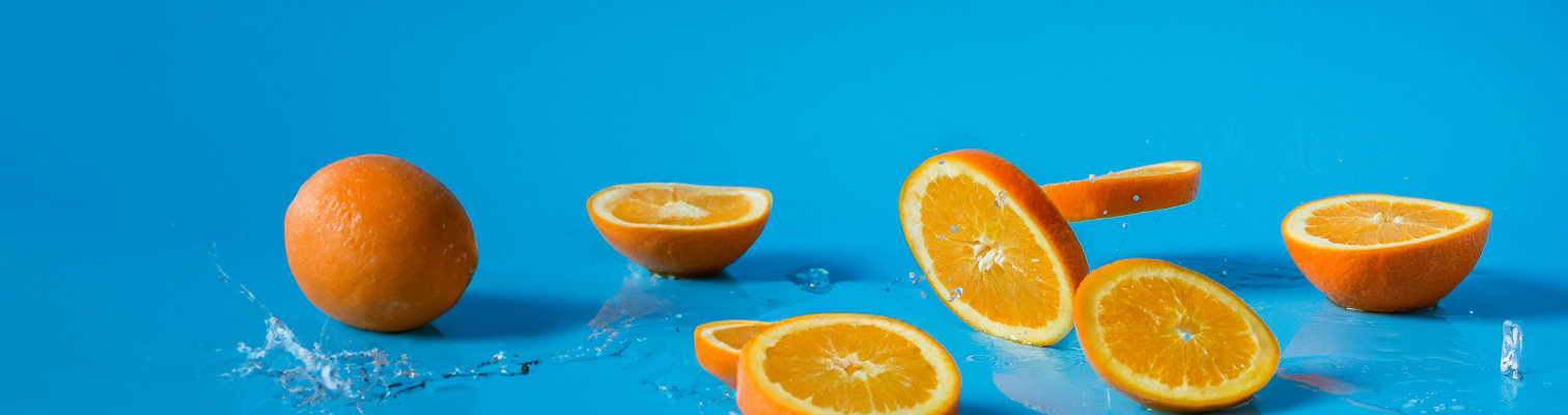 Photograph of oranges on a blue background