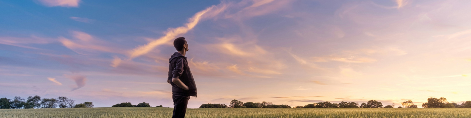 Photograph of a man looking at the sky